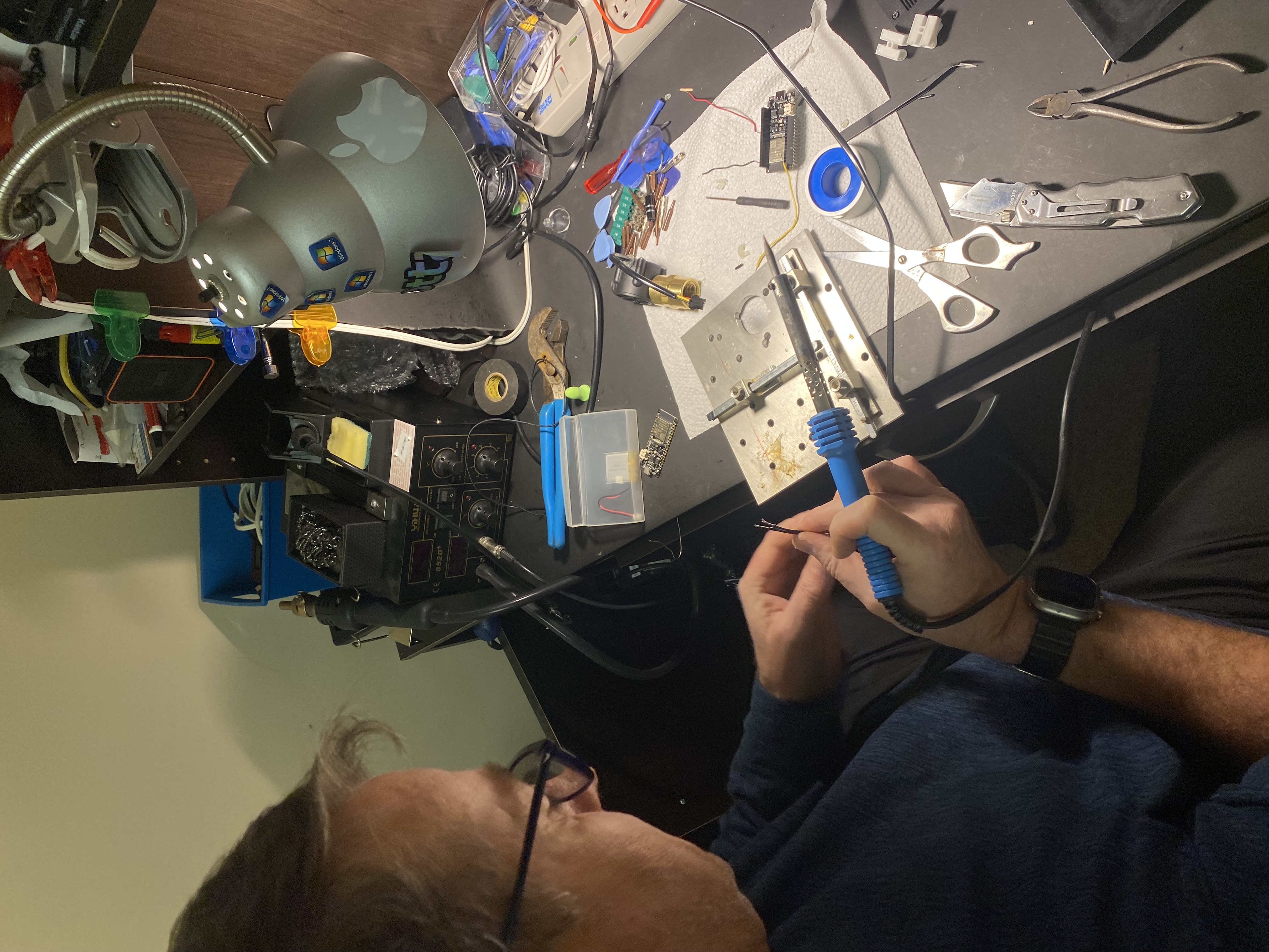 My dad helping solder the first MVP in our basement
